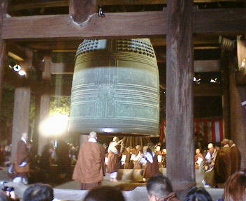 Buddhist monk ringing bell